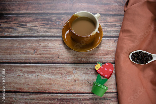 cup of coffee on wooden photo