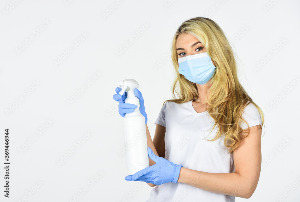 Wearing mask protect from coronavirus. Personal hygiene. Cleaning and Disinfection. Serious hygiene. Disinfection concept. Risk being exposed coronavirus. Girl clean frequently touched surfaces Wearing mask protect from coronavirus. Personal hygiene. Cleaning and Disinfection. Serious hygiene. Disinfection concept. Risk being exposed coronavirus. Girl clean frequently touched surfaces