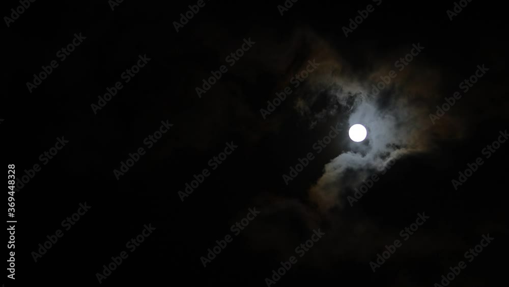Clouds passing by moon at night. Full moon at night with cloud real time. mystery fairyland scene. Clouds passing by moon at night. Full moon at night with cloud real time. mystery fairyland scene.