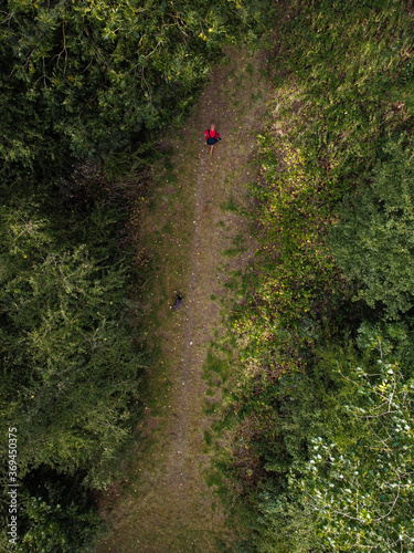Ariel picture of man walking in the woods/Drone Photography.