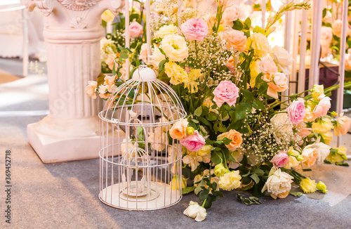 wedding decoration with beautiful vintage birdcage and flowers.