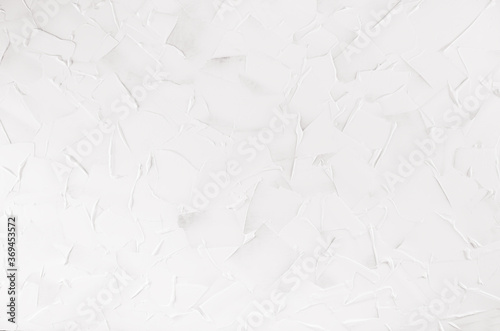 Simple white plaster texture with waves and smears as modern soft light background.