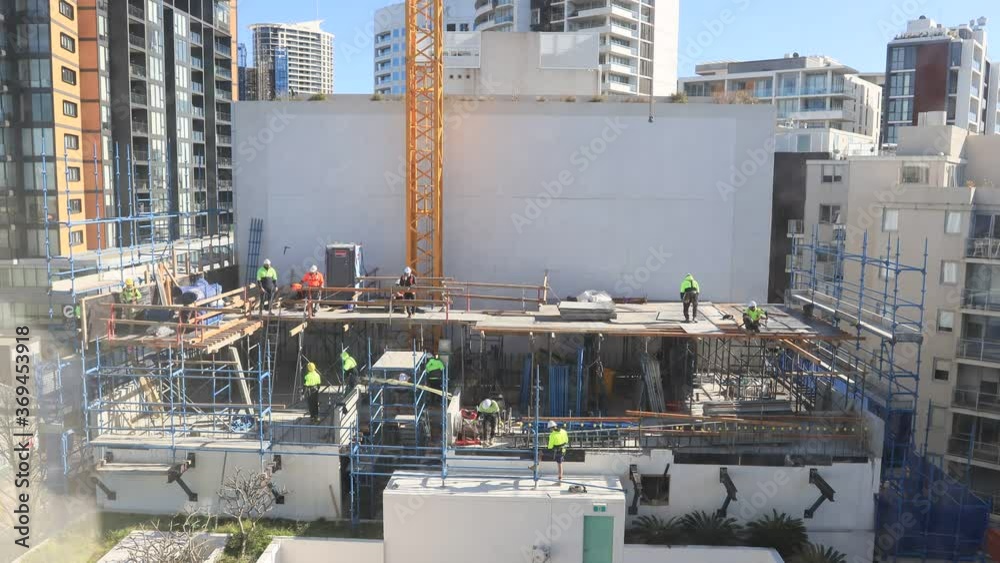 Growing real estate house as construction site with workers – 4k time lapse.
