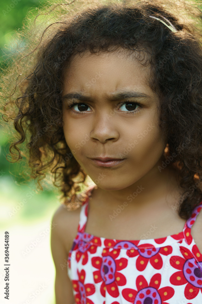 Portrait of cute black girl in a city park Portrait of cute black girl in a city park