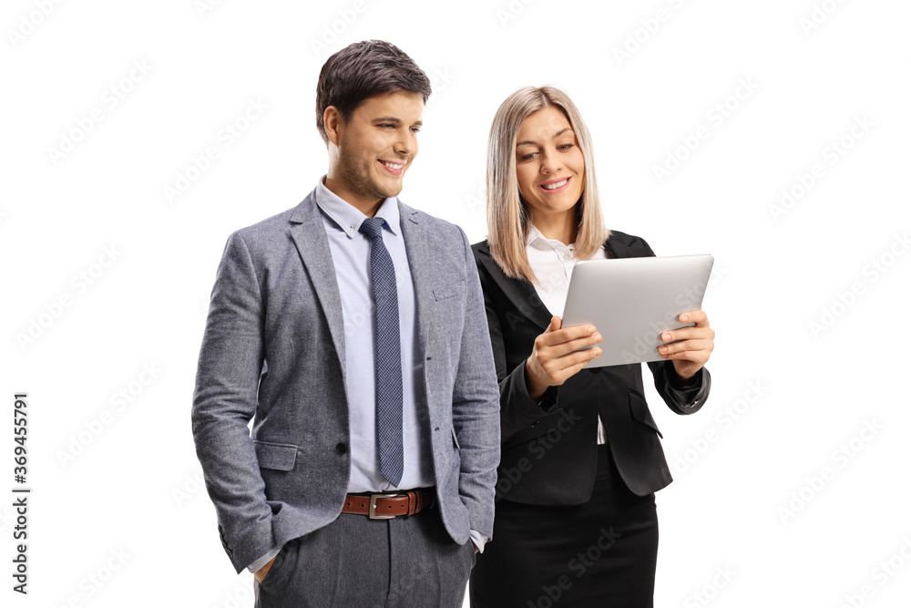 Professional young man and woman looking at a digital tablet Professional young man and woman looking at a digital tablet