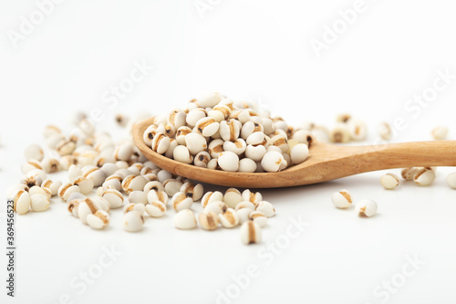 Slika na platnu Pearl barley in wooden spoon