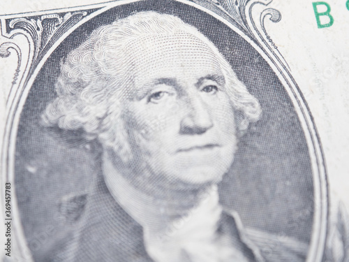 portrait of the first president of the United States, the US founding father George Washington on the one dollar bill, background of the money, one dollar bills front side obverse. close up, America
