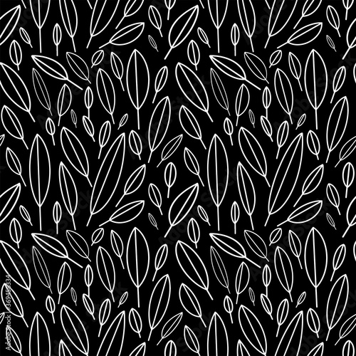  Seamless pattern in Scandinavian style. Pattern of white leaves on a black background. Black and white pattern 