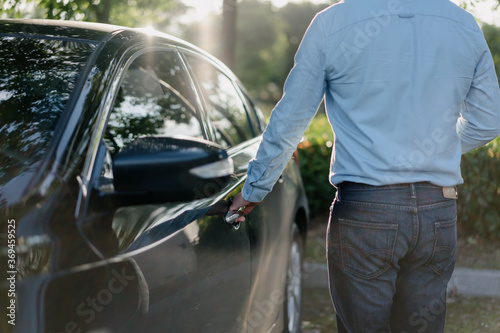 Business people unlock cars with smart phone