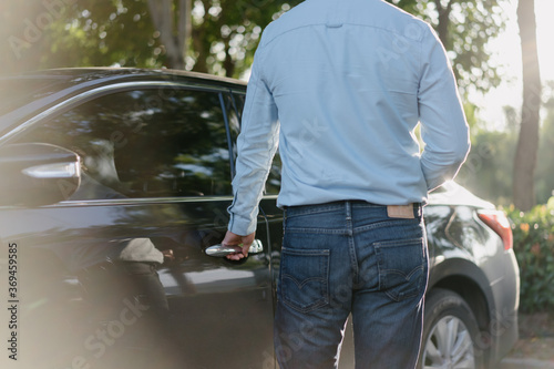 Business people unlock cars with smart phone