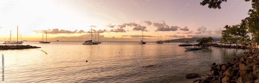 Boats shadows in the Trois Ilets Beach in the Caribbean Island in Martinique in France