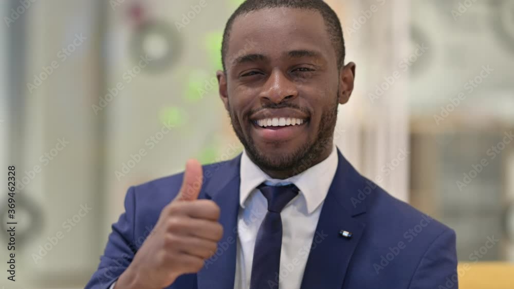 Portrait of African Businessman showing Thumbs Up Sign 