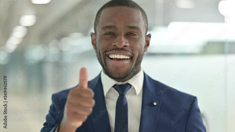 Portrait of African Businessman showing Thumbs Up Sign Portrait of African Businessman showing Thumbs Up Sign