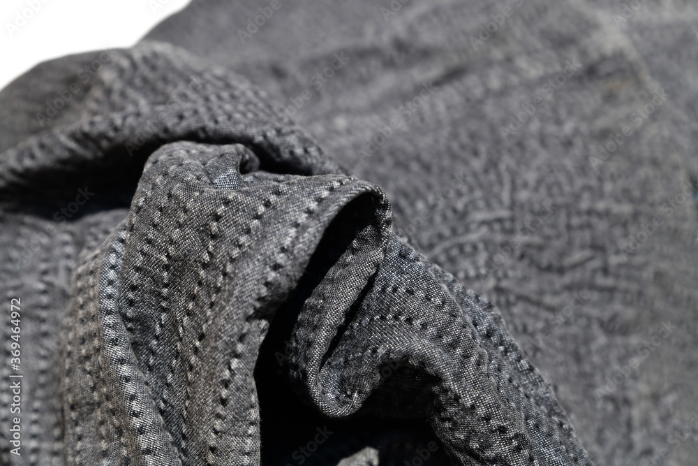 Obraz premium ステッチの入った黒っぽい布、イメージ素材