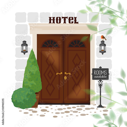 Beautiful old hotel door with available rooms advertisement in front of