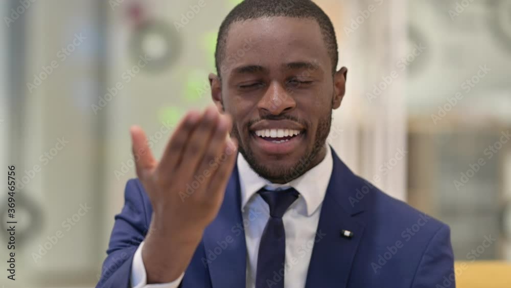 Portrait of African Businessman with Pointing Finger and Inviting Portrait of African Businessman with Pointing Finger and Inviting