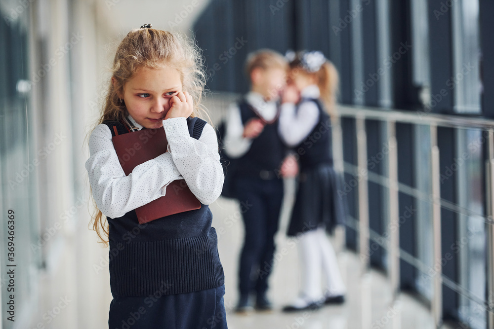 Little girl gets bullied. Conception of harassment. School kids in ...