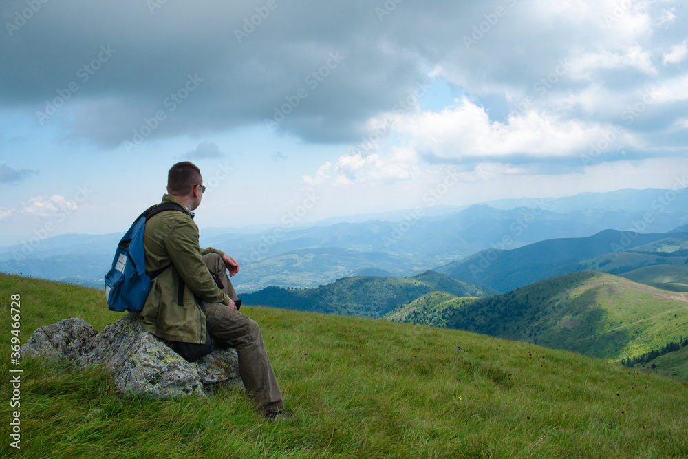 Hiker man on the top of mountain in Kopaonik, Serbia