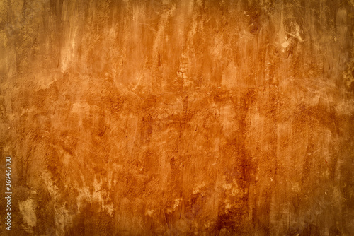 Cement wall texture background - old cement concrete wall with red warm light filter