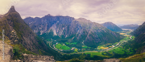 panorama of the mountains in the morning - Romsdalshorn and romsdalen in Rauma  Norway