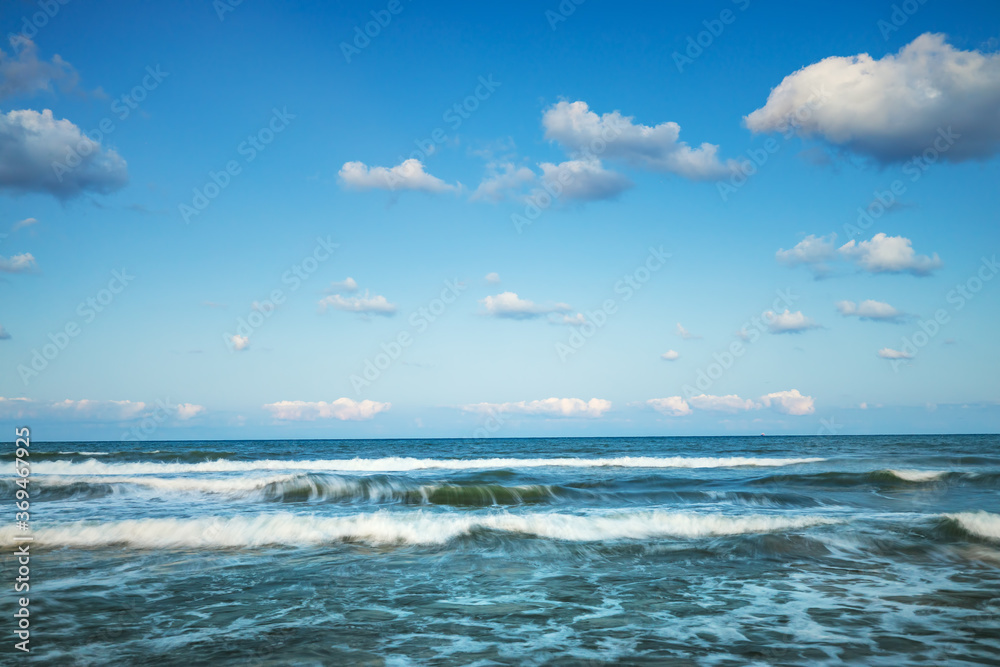 Waves amd sea ripple water with blue clody sky