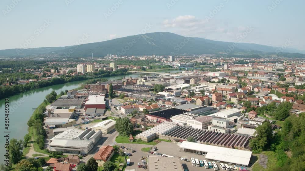 4K Moving Back Drone Shot Of City Alongside A River 4K Moving Back Drone Shot Of City Alongside A River