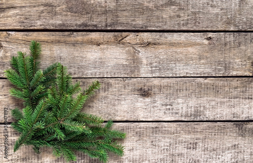 Christmas background, old wood texture, festive corner decorate. Pine fir leaf, twigs. Xmas, New Year wallpaper, greeting card, top view flat lay.