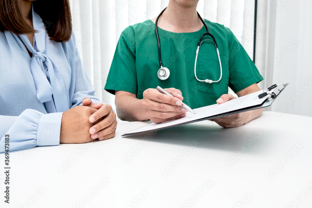 Male doctors explain and recommend treatment after a female patient meets a doctor and receives results regarding illness problems. Medical and health care concepts Male doctors explain and recommend treatment after a female patient meets a doctor and receives results regarding illness problems. Medical and health care concepts