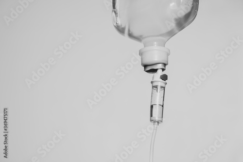 0.9% Normal saline solution (NSS) isolated on white background and for medical background. Close up image. Drops of saline. 