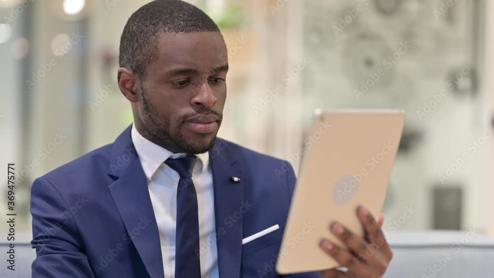 Portrait of African Businessman using Digital Tablet Portrait of African Businessman using Digital Tablet