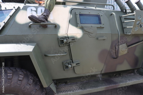 military black boot of soldier on paratrooper vehicle