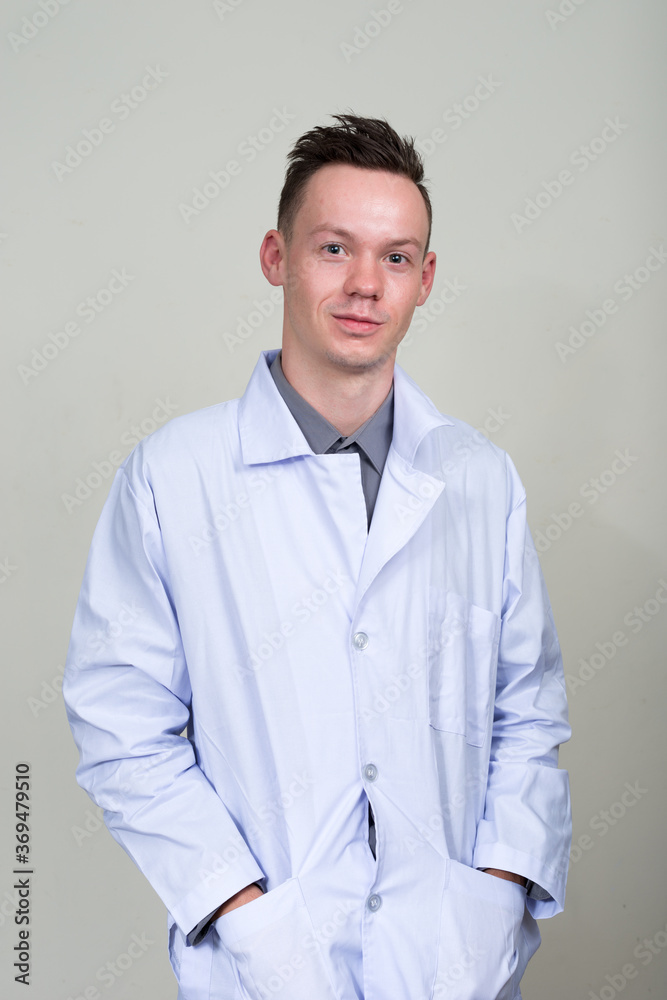 Portrait of young man doctor looking at camera Portrait of young man doctor looking at camera
