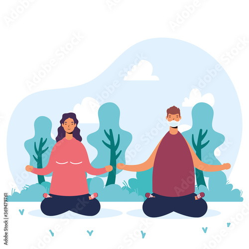young couple wearing medical masks practicing yoga