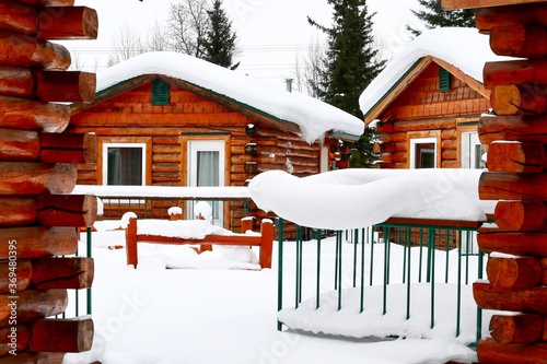 Fairbanks, Alaska, March-7-2019 : Log cabins covered with fresh snow in Pike’s Waterfront Lodge