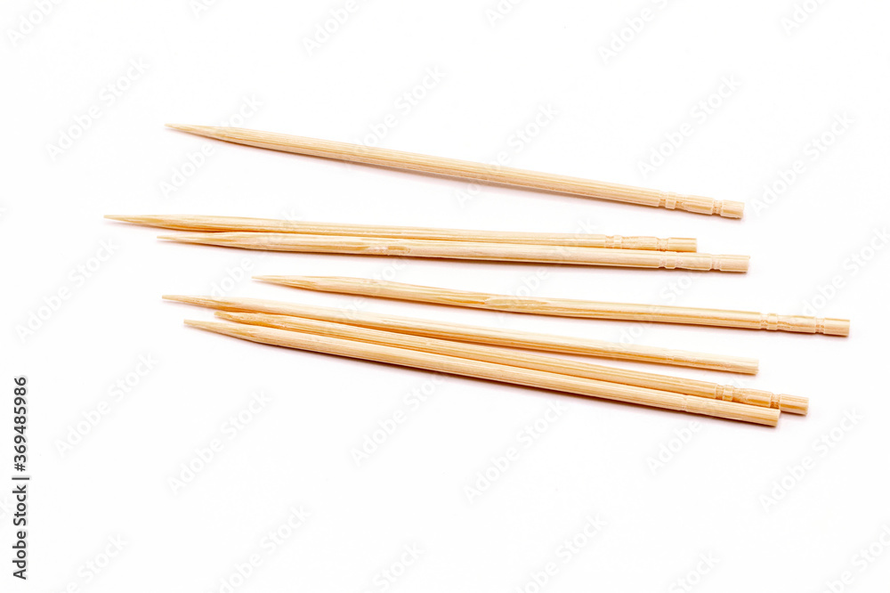 Close up wooden toothpicks in a box isolate on white background. Close up wooden toothpicks in a box isolate on white background.