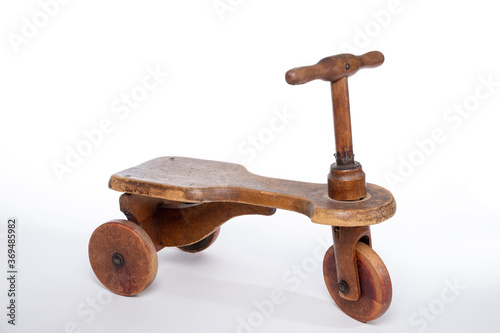 Antique wooden chilren's riding toy isolated on a white background photo