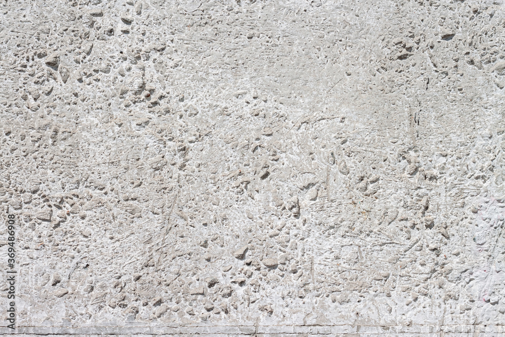 Concrete with rocks wall bumpy surface cool urban grungy wallpaper macro