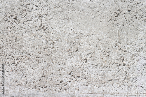 Concrete with rocks wall bumpy surface cool urban grungy wallpaper macro