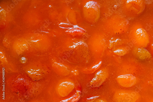 The surface of apricot or peach jam. Copy space.