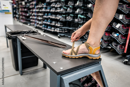 girl trying on sandals