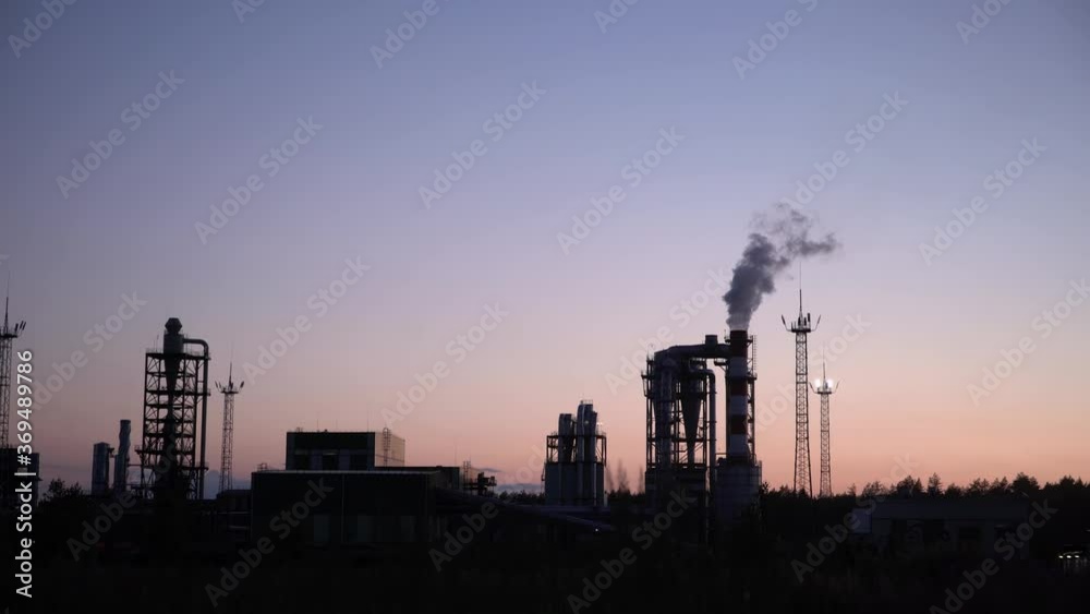 industrial landscape, the pipes of the thermal power plant at sunset industrial landscape, the pipes of the thermal power plant at sunset