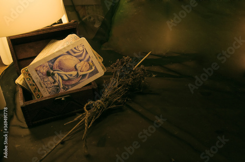 arot cards and dried St. John's wort photo