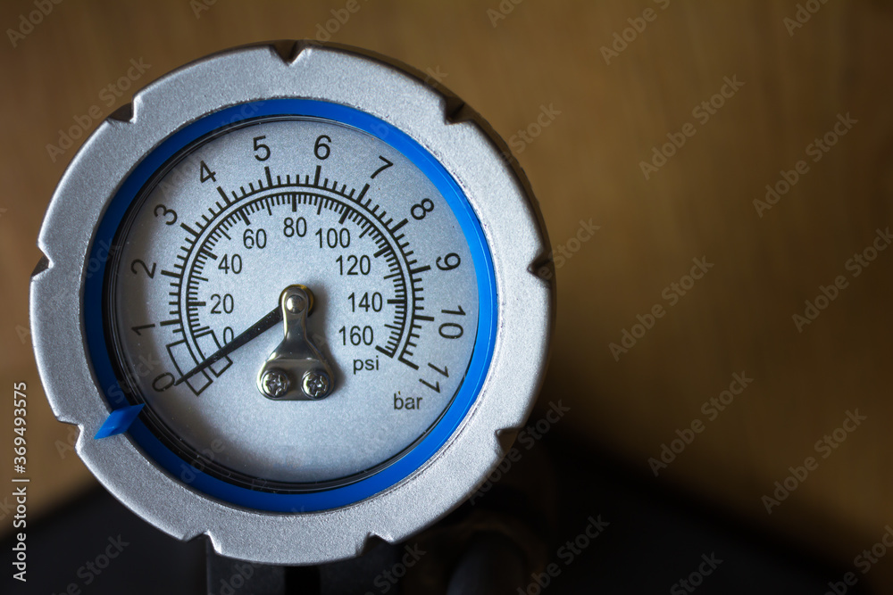 Air pressure manometer (tire pump) on wooden background Air pressure manometer (tire pump) on wooden background