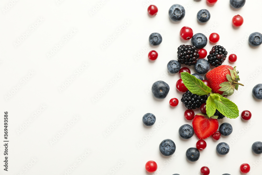 Mix of fresh berries on white background, top view Mix of fresh berries on white background, top view