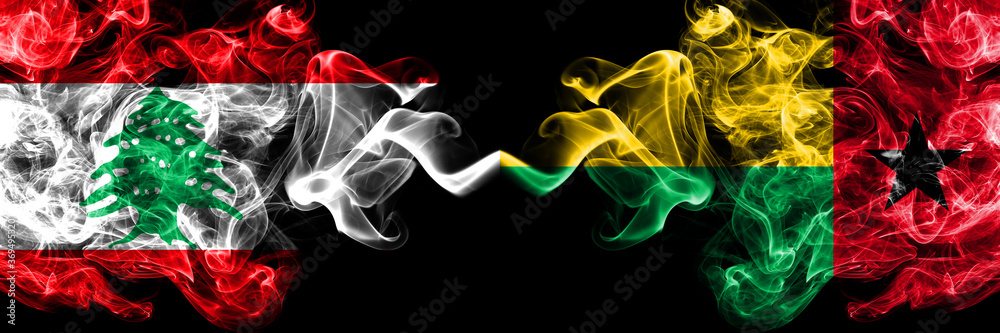 Fototapeta premium Lebanon vs Guinea Bissau smoky mystic flags placed side by side. Thick colored silky abstract smoke flags.