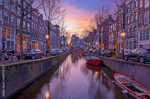 City scenic from Amsterdam at the Oude Zijdsvoorburgwal in the Netherlands at sunset