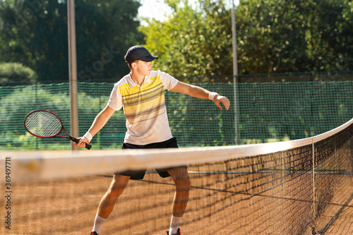 Young tennis player in motion © Andrii 