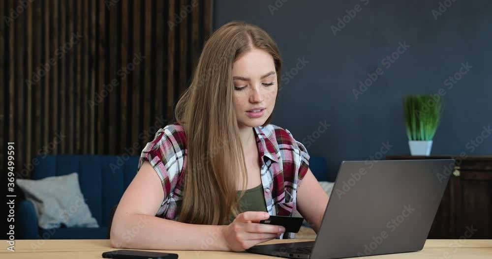 Attractive caucasian Woman is buying online on her Laptop, using Credit Card. Beautiful Woman ordering delivery at Home Office, getting Shopping from Home. Online Lifestyle. Casual People, Lifestyle. Attractive caucasian Woman is buying online on her Laptop, using Credit Card. Beautiful Woman ordering delivery at Home Office, getting Shopping from Home. Online Lifestyle. Casual People, Lifestyle.