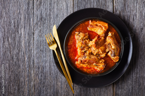 Braised Pork pieces in a black bowl