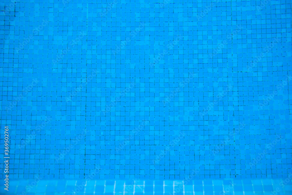 blue background with mosaic and water in the swimming pool blue background with mosaic and water in the swimming pool